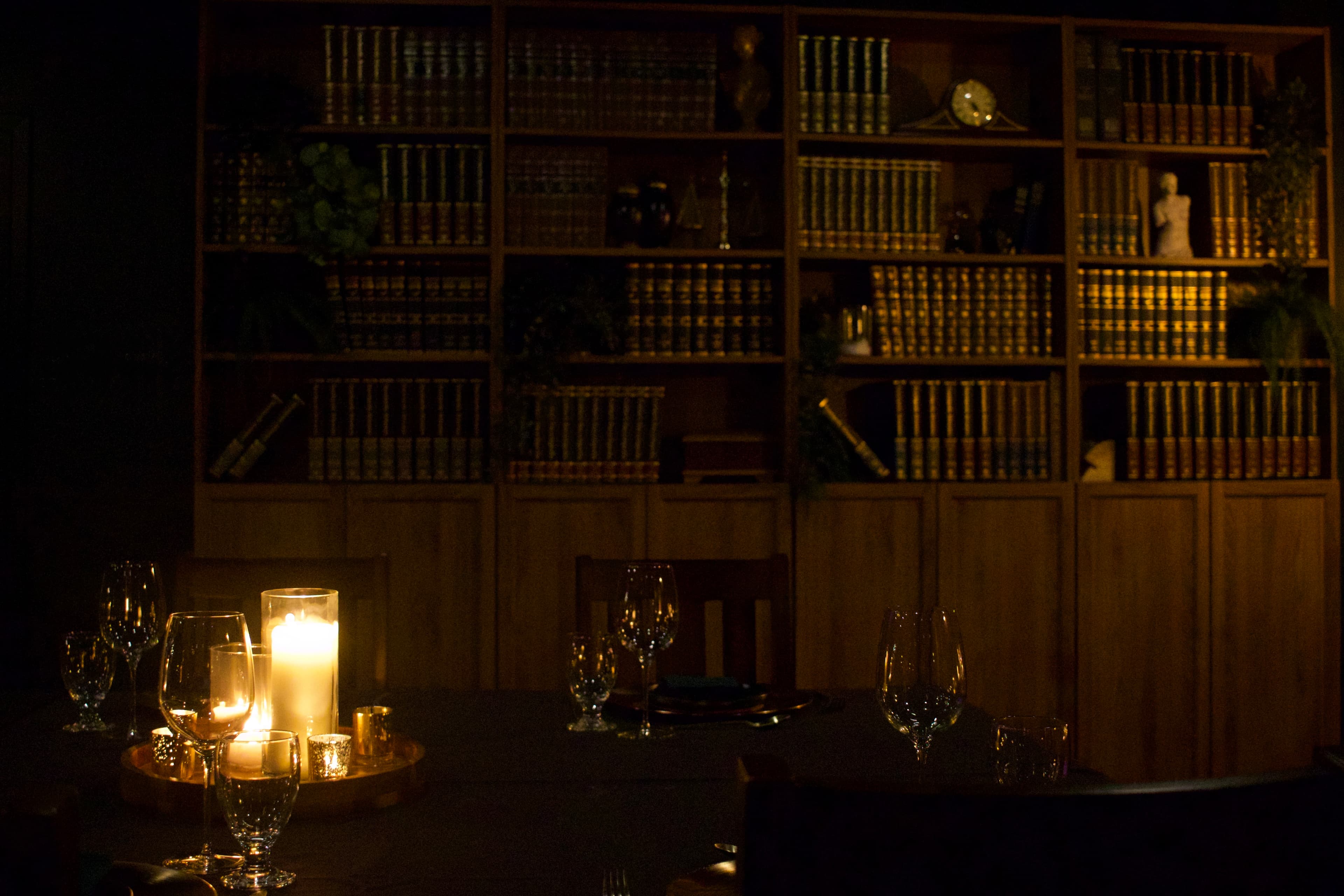 Elegant restaurant interior with warm lighting and tropical plants